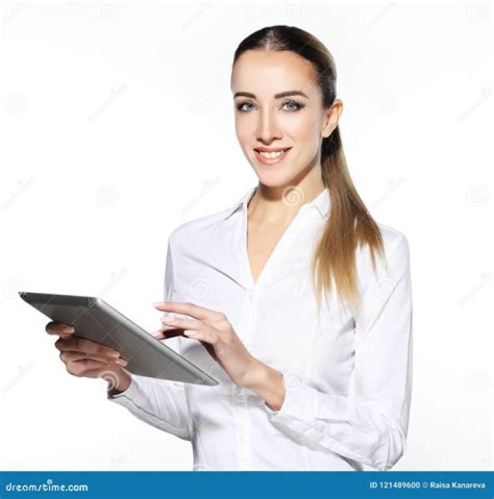 A woman holding a tablet computer | Source: Pexels