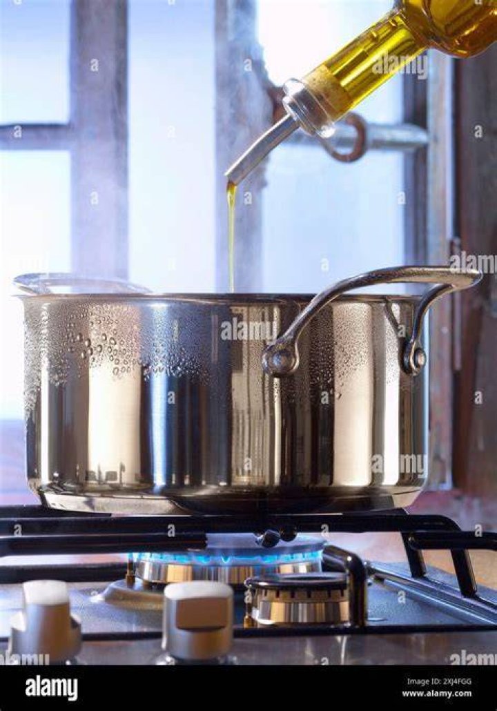 adding oil to boiling water