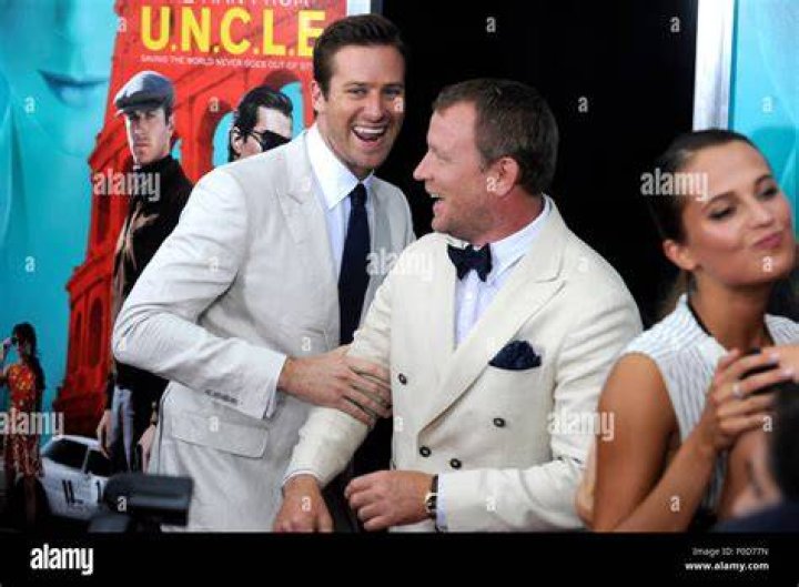 Armie Hammer, Guy Ritchie, and Henry Cavill pose during SiriusXM's Entertainment Weekly Radio on August 12, 2015, in New York City | Source: Getty Images