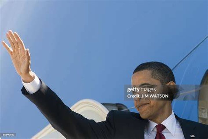 Barack Obama waves as he walks with First lady Michelle Obama and their daughters Malia and Sasha on the South Lawn of the White House in Washington upon their return from a summer vacation in Martha's Vineyard, Massachusetts, on August 21, 2016. | Source: Getty Images