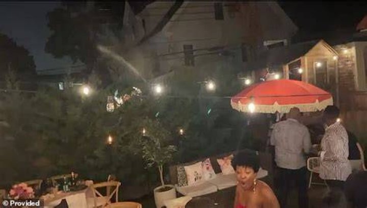 Black partygoers ran for cover after being sprayed with a hose at the surprise birthday dinner hosted by Dr Yves Duroseau