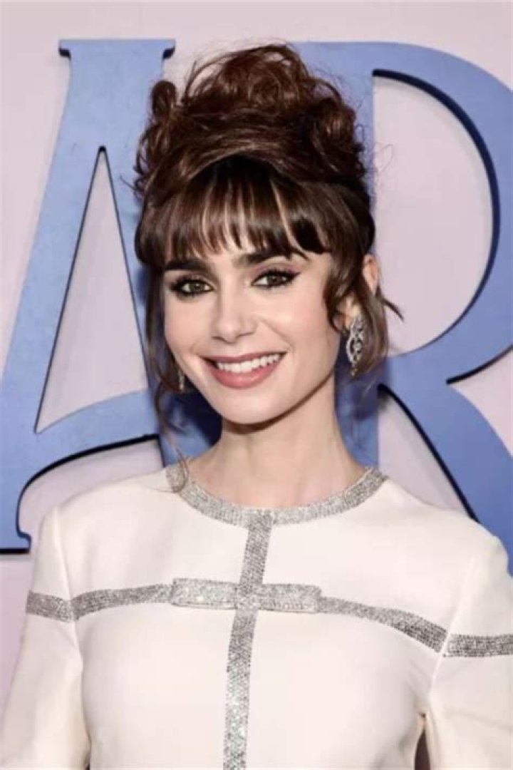 Chic: The leading lady of the hit Amazon Prime show, 30, embraced her onscreen character Miriam in the smart number which had a dramatic silk skirt and high-neck collar