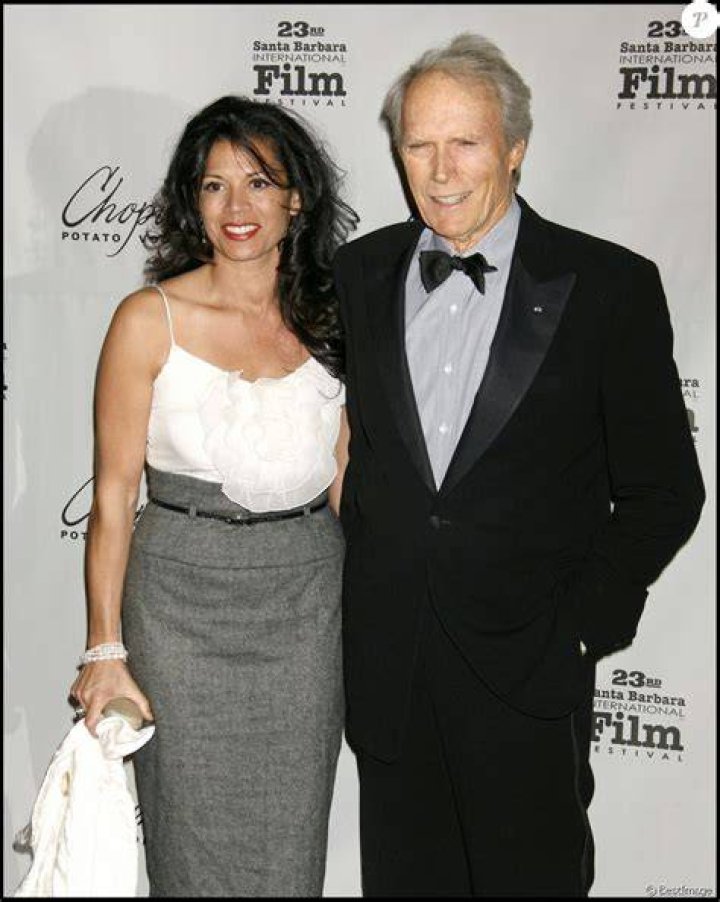 Clint Eastwood and Dina Ruiz at the "Invictus" Premiere on January 31, 2010, in London | Source: Getty Images