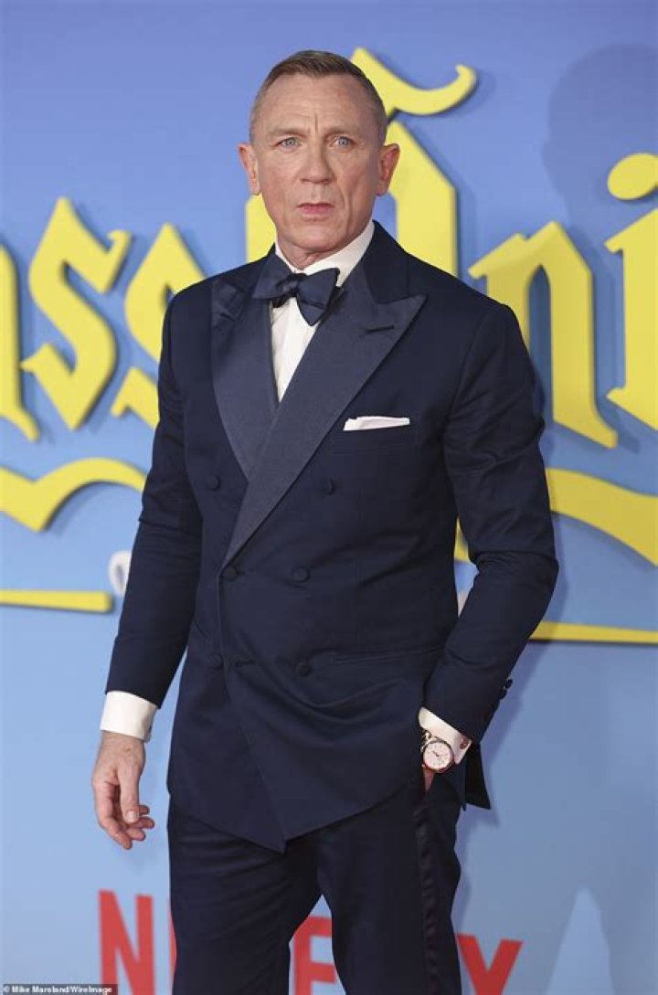 Dapper: He completed the look with black trousers, shiny shoes and a bow tie