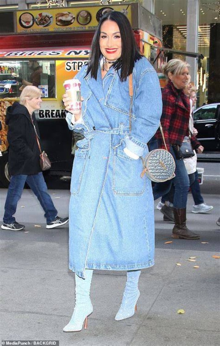 Denim daze: Before walking into the studio, the looker had on a denim coat