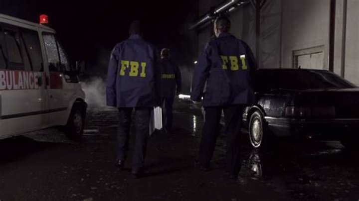 FBI agents approaching a crime scene