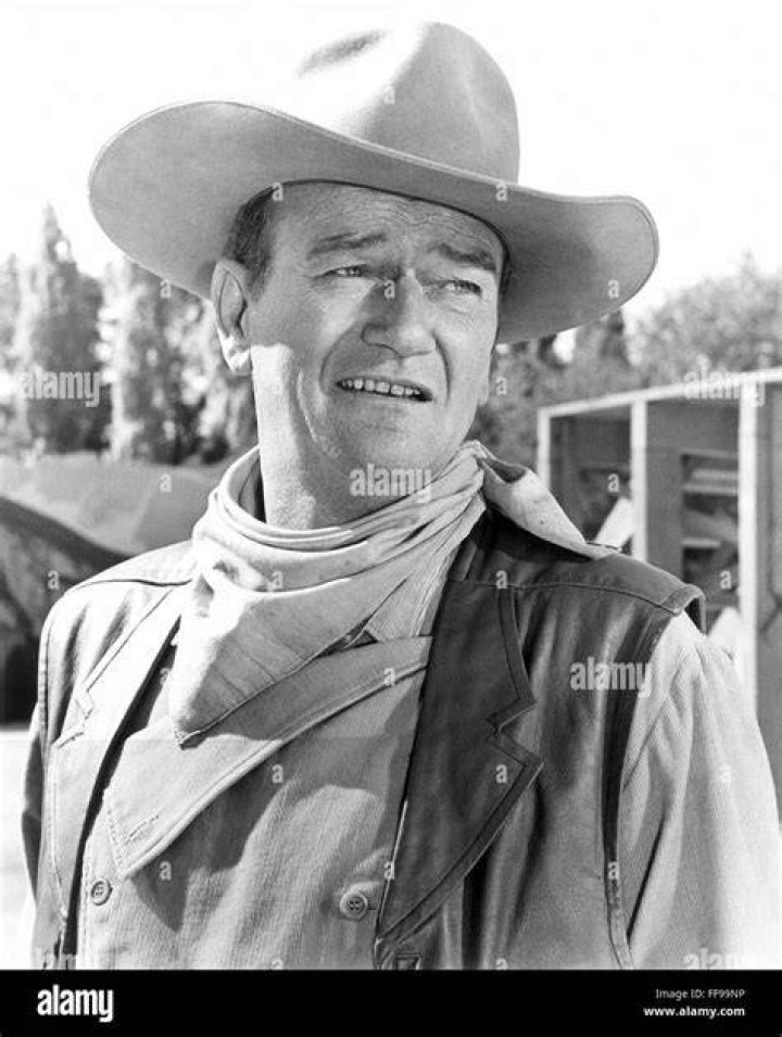 John Wayne (1907 - 1979) and Marlene Dietrich (1901 - 1992) star as gold miner Roy Glennister and saloon entertainer Cherry Malotte in 'The Spoilers' | Source: Getty Images