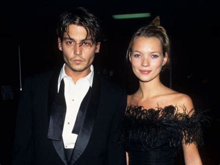 Kate Moss and Johnny Lee Miller at the Rover British Fashion Awards, in Battersea Park, London, on February 21, 2001. | Source: Getty Images