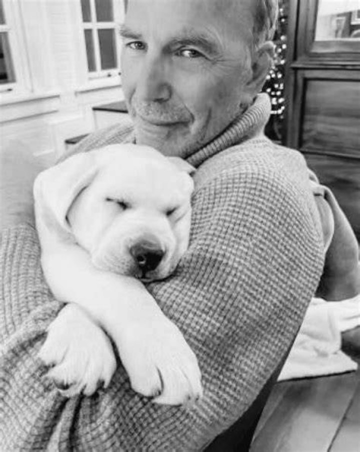 Kevin Costner with his dogs in the garden of his Spanish-style home on March 4, 2002, in the Hollywood Hills of California | Source: Getty Images