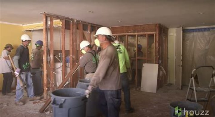 Men working on renovating Mila Kunis' parents' condo | Source: