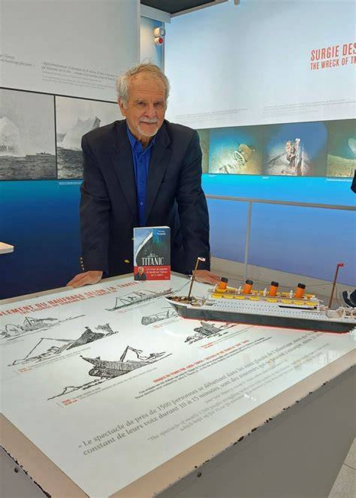 Paul-Henri Nargeolet with a miniature version of the sunken ship inside a new exhibition at the Paris Expo on May 31, 2013, in Paris. | Source: Getty Images