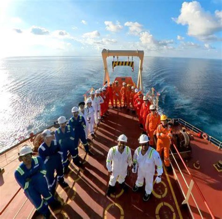 The crew member was loaded onto a stretcher and taken away for medical treatment