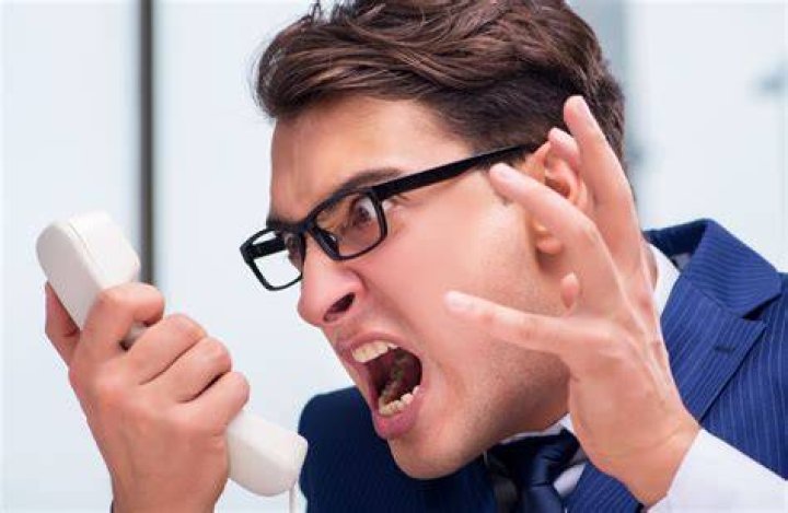 The enraged customer threatening the McDonald's staff | Photo: 