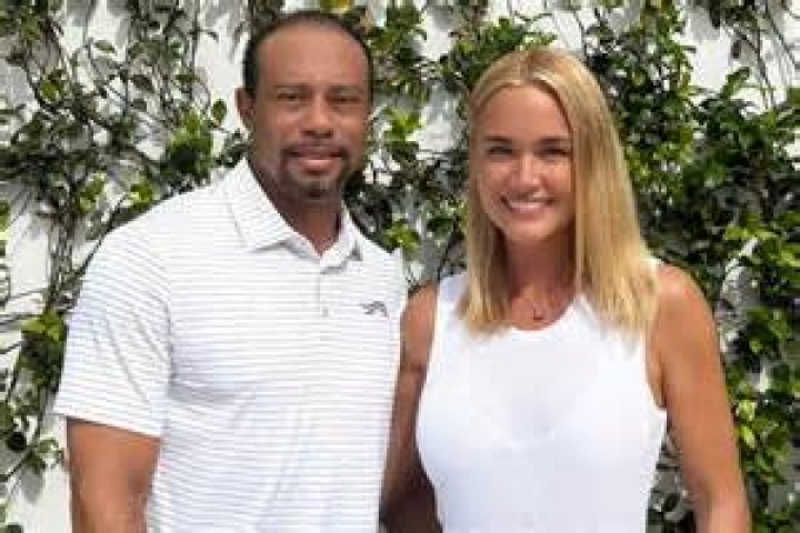 Tiger Woods poses with girlfriend Erica Herman before the Ryder Cup gala dinner | Photo: Richard Heathcote/Getty Images