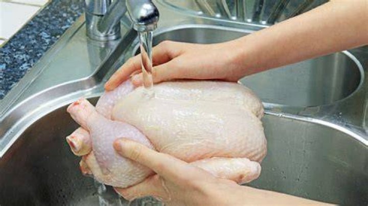 washing raw chicken